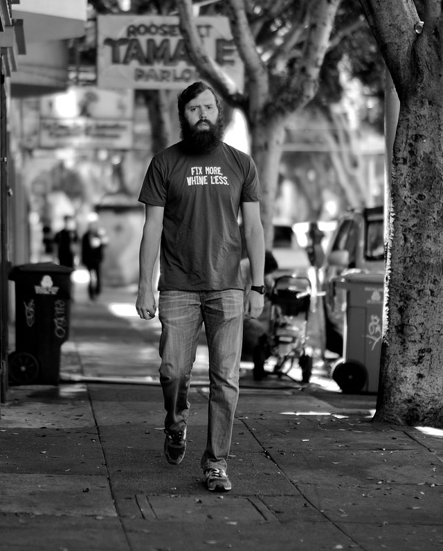 "Fix More, Whine Less" does this t-shirt say on 24th Street in San Francisco. Leica M9 with Leica 50mm Noctilux-M ASPH f/0.95 and B&W 8X ND-filter. © 2011-2016 Thorsten Overgaard. 