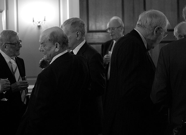 Fellows meeting before the evenings dinner. Had they turned their head and seen me, nor I or this photo would exist anymore. Leica M Monochrom with Leica 50mm Noctilux-M f/1.0