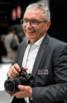 Lens designer Peter Karbe at Photokina 2016. Photo by David Farkas.