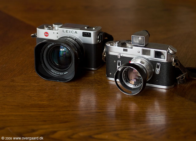 Leica Digilux 2 next to the Leitz M4 in chrome from 1974. The lens is the 50mm Summicron-M f/2.0 and I've kept a 21mm viewfinder on top of the M4 to make a point.