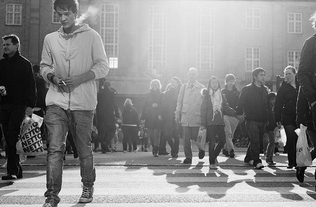 People passing the street in front of the trainstation in Aarhus, Denmark