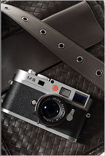 The Leica M9 in metal-grey paint (with a black lens) prominently displayed in the New York Times' fashion section on September 10, 2009, "Dress Codes Accessories for Men"