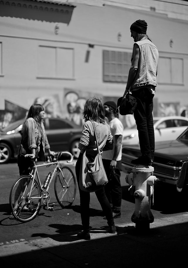A group of young people having a talk outside a cafe in San Francisco. Leica M9 with Leica 50mm Noctilux-M ASPH f/0.95 and B&W 8X ND-filter 