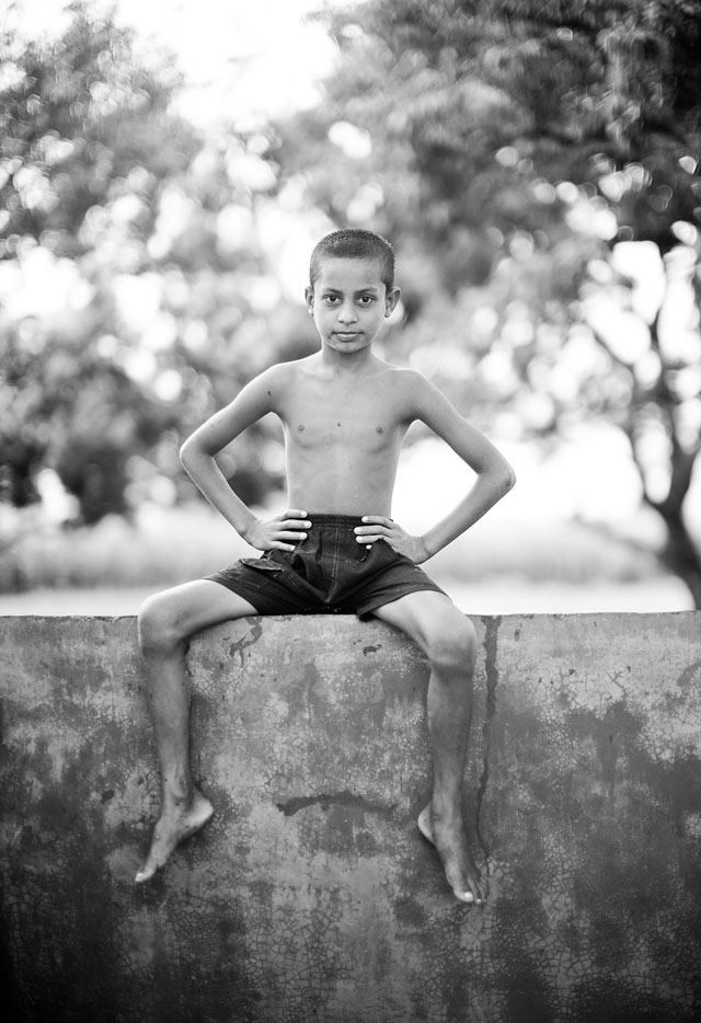 A neighbour boy poses in a resort outside the town of Dinajpur, Bangladesh. © 2014 Thorsten Overgaard. Leica M 240 with Leica 50mm Noctilux-M ASPH f/0.95. 