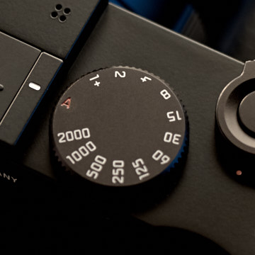 Shutter speed dial

The shutter speed dial can be left at A (aperture priority) and the Leica Q2 will suggest a shutter speed to get the exposure right. 

If you want to 'go manual' and set the shutter speed manually you simply turn the shutter speed dial to the desired speed.

The mechanical shutter speed goes to 1/2000th of a second, but the Leica Q2 can go to 1/20,000th of a second with the internal electronic shutter that will take over if needed (when there is a lot of light). 