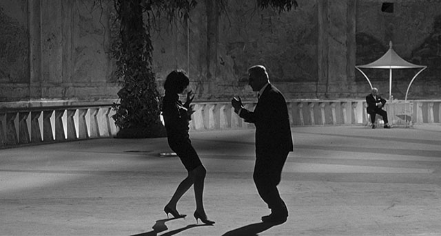Simple as this. Just have the light behind and no softening light on the front of a person and you have dramatic silhouettes. Yet, notice the person in the back with light on him; and his skin tone in the face is exposed correctly. “8½” by Federico Fellini (1963, cinematographer: Gianni Di Venanzo).