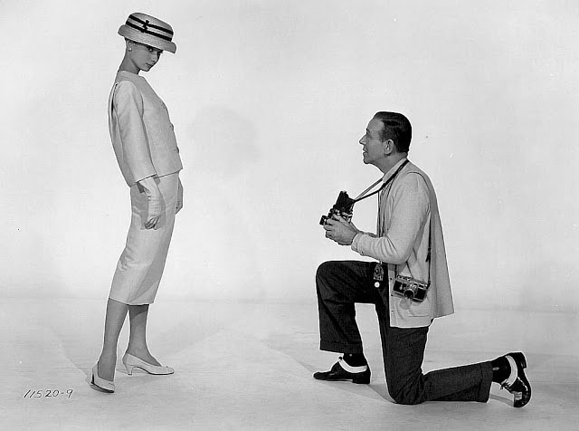 Audrey Hepburn in the studio with Fred Astaire who has his Leica and Rollieflex.   