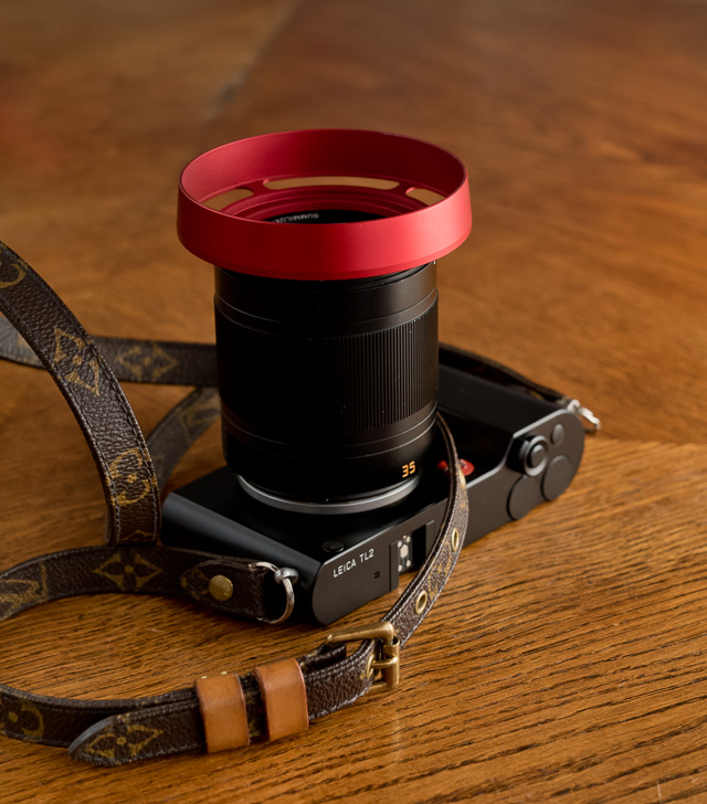 The Leica TL2 with the Leica 35mm Summilux-TL ASPH f/1.4 with my own designed E60 Ventilated Shade that I make in Black Paint, RED and Silver. 