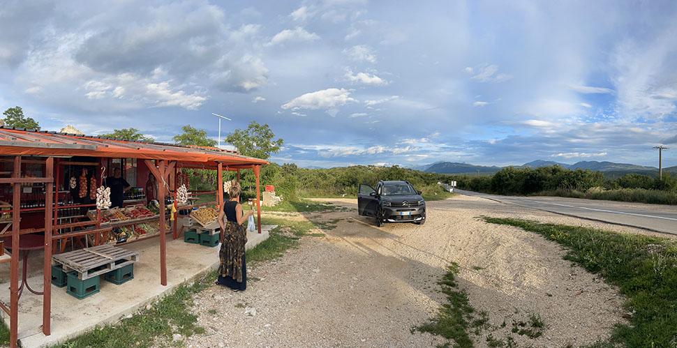 Stopping to buying fruit on the road between Sarajevo in Bosnia & Herzegovina and Perast in Montenegro. iPhone panorama photo. © Thorsten Overgaard.