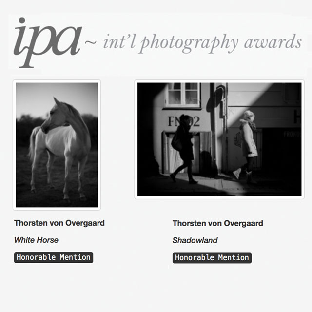 Two photographs by Thorsten Overgaard , "Shadowland" and "White Horse" won Honorable Mentioning in IPA Awards 2017 - Photographer of the Year competition.