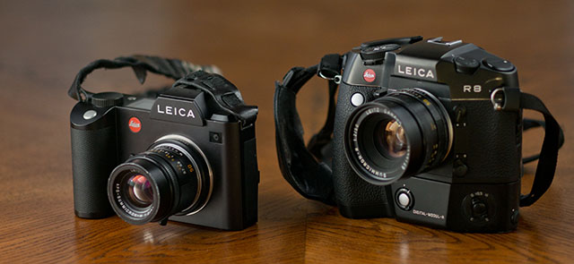 Leica SL (2015) left with a Leica 50mm f/2.0 APO lens for Leica M via adapter, and to the right the Leica R8 film camera (1998) with the aded 10MP DMR digital back (2004) and a 50mm f/2.0 Leica R lens. © Thorsten Overgaard.
