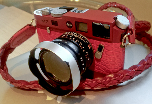 Red Leica M7 with red, red, red. That guy has some balls. Leica 35mm FLE with ventilated lens hood.