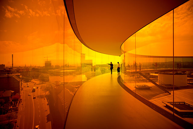 My photograph from inside the "Your Rainbow Panorama" sculpture by Olafur Eliasson on top of the ARoS International Art Museum in Aarhus, Denmark (it's actually a big ring added on top of the building that one can walk inside; and the glass walls change in the colors of the rainbow as you walk through).  Leica 21mm Summilux-M ASPH f/1.4. © Thorsten Overgaard.