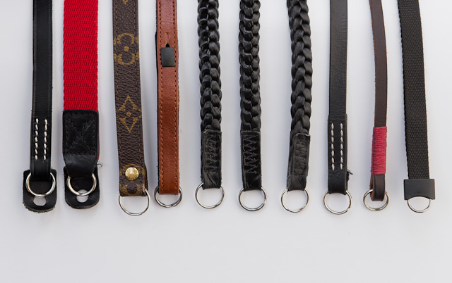 A cavalcade of camera straps for the Leica M. From left A&A 250, A&A, Louis Vuitton, Leica A la Carte in brown, Annie Barton glossy black x 2, Annie Barton matte black, A&A 252, Gordy's camera strap, and finally to the right, the standard Leica camera strap that comes with the Leica M 240, Leica M9 and Leica M9-P (The Leica M Monochrom comes with a black leather strap not shown here. It can be bought as a spare part from any Leica Store). 