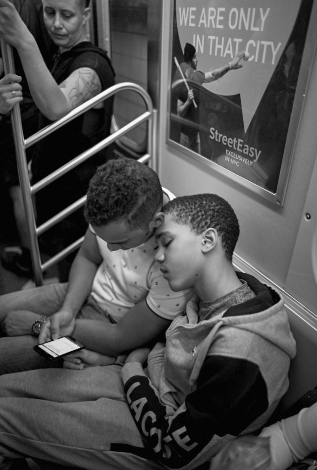 Brothers on the train uptown in New York. Leica M Monochrom with Leica 28mm Summilux-M ASPH f/1.4. © Thorsten Overgaard. 