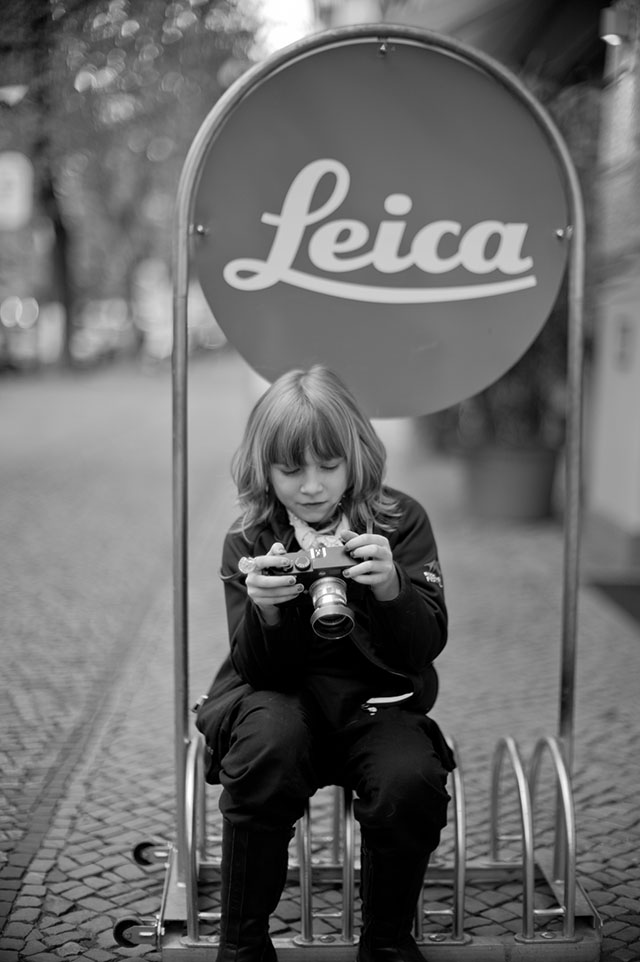 My daughter Robin Isabella outside Mesiter Camera in Berlin. Leica M Monochrom (2012) with Leica 50mm Noctilux-M f/1.0 (1976).