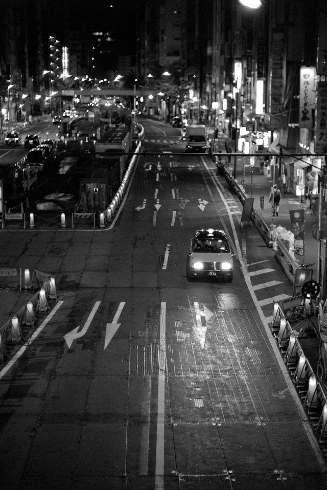 After midnight in Tokyo: The every-ongoing roadwork in one of the busiest Tokyo crossings to keep it running smoothly. Leica M Monochrom with leica 50mm Noctilux-M f/1.0, 3200 ISO.  