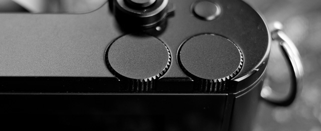 The Leica TL2 has two Function wheels, as well as one Function button. 