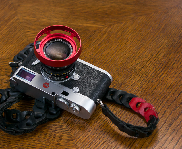 My Leica M10 in silver with the Leica 35mm Summilux-M ASPH f/1.4 AA. With one of the ventilated shades I have designed (limited red E46 edition) and the Tie Her Up strap made for Leica M10. 