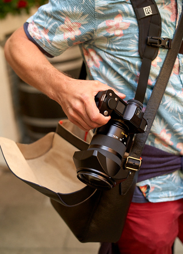 My good friend Rob is one of the people I know who abandoned the Leica M system and often carries two Leica SL bodies. He uses an double BlackRapid strap for that, which means you are really strapped up and dressed for photography. Here is his Leica SL with the 24-90mm zoom and an "Always Wear A Camera" Leica SL camera bag that I designed. 
