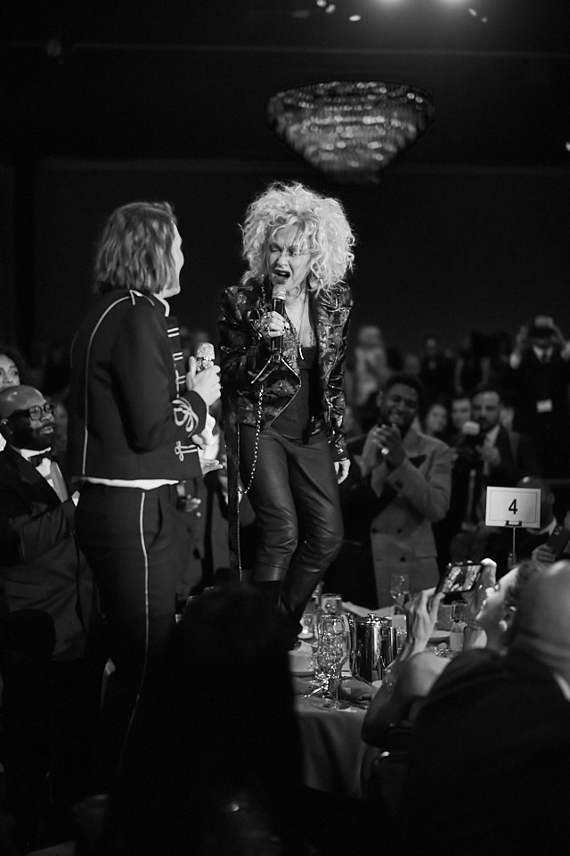 Brandi Carlile and Cyndi Lauper dancing on the tables at the Clive Davis Pre-Grammys Gala 2020. Leica M10-P with 50mm Summilux-M ASPH f/1.4 BC. © Thorsten Overgaard. 