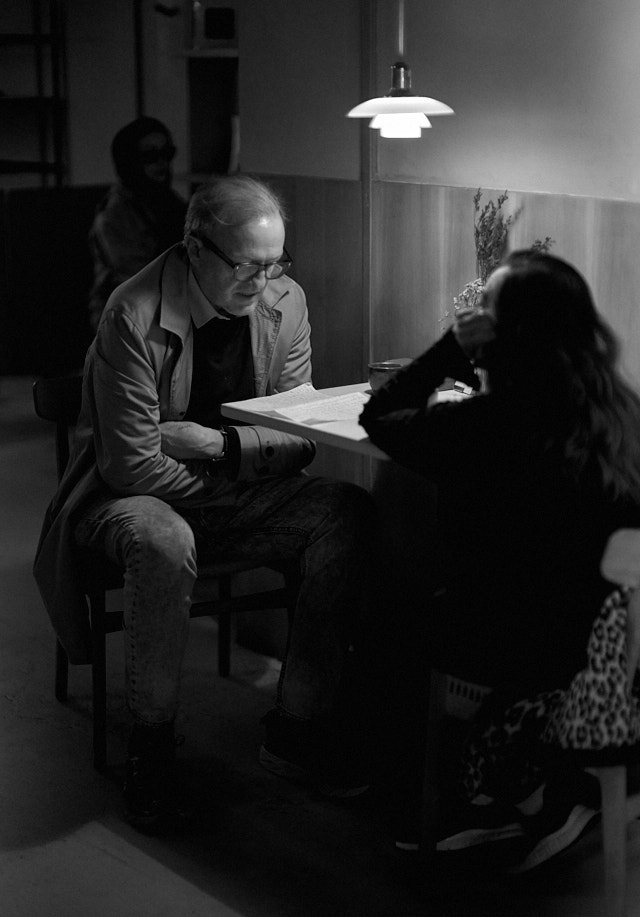 Reading a letter aloud from a distant releative. At least, that's the story I decided I was photographing. Leica M10-R with Leica 50mm Noctilux-M ASPH f/0.95. © Thorsten Overgaard. 