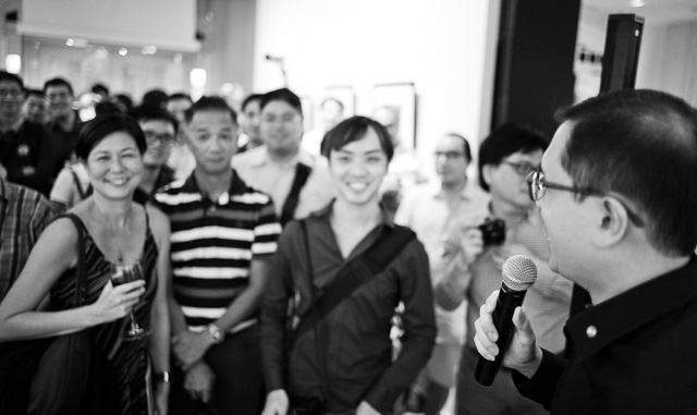 The hero of the day, Leica Store Manager Mr. Ray Tan making sure everybody gets home with a print in support of the children of Cambodia!