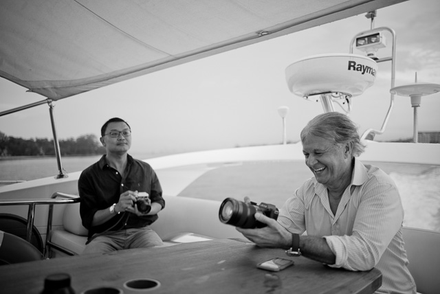 Boat trip on the “Ovulation”The boat was amped up on cameras. Here's the SL in the hands of Christopher Wilson with Mr. Charles Koh in the background. Leica M 240 with Leica 28mm Summilux-M ASPH f/1.4. © 2015 Thorsten Overgaard. 