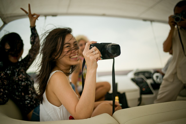 Boat trip on the “Ovulation” of Mr. Gordon Tan and Alicia Koo to see Singapore from the water in the sunset. Here it's Alice with one of the many Leica Q cameras on board. Leica M 240 with Leica 28mm Summilux-M ASPH f/1.4. © 2015 Thorsten Overgaard. 