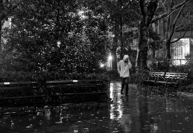 Madison Suqare Park in the rain, at 1/12th of a second, the person is walking, which causes the motion blur.  
