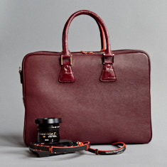 An elegant and simple carry-on bag made for 2-4 Leica M cameras with 4 lenses and accessories (here shown with croc handles). 