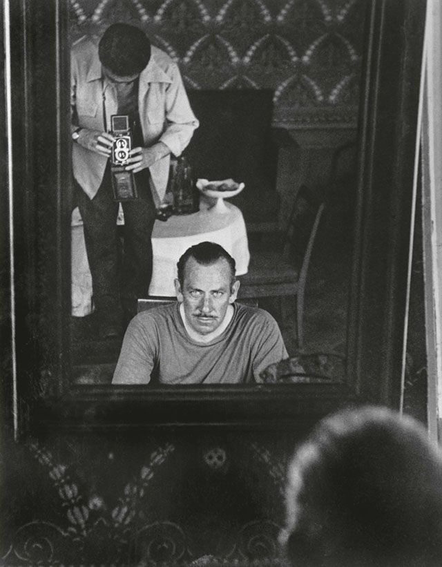 Robert Capa also used medium format. Here photographing John Steinbeck in 1947 .