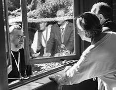 Thorsten Overgaard photographing in through the window. Photo by Takaaki Arai.