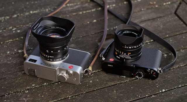 The Leica Digilux 2 from 2004 and the Leica Q from 2015. Both Leica cameras primarily developed by Leica Camera AG, and both using only an Electronic Viewfinder (EVF), allowing the camera to use a central shutter in the lens and thus make the camera completely silent when it takes pictures. © Thorsten Overgaard.