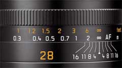 The lines on this 28mm lens indicates the DOF. Here the focus is on infinity, and if the lens is stopped down to f/1.6, objects from 1.8 meter to ininity will be 'acceptable sharp'.