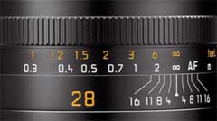 The markings on this 28mm lens indicate the depth of field (DOF). In this case, the focus is set to infinity, and if the lens is stopped down to f/1.6, objects from 1.8 meters to infinity will be acceptably sharp.