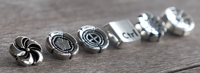 Sterling silver soft release buttons for Leica and other camera, from Bashert and LeiacRumors. 